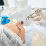 Woman in a dental chair having a tooth extraction